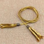 Ceinture fine à nouer modèle Tumunia - Dorée / 80-130 cm